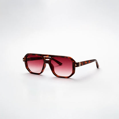Gafas de sol de estilo aviador geométrico Miami Heat con montura gruesa de carey y lentes marrón degradado.
