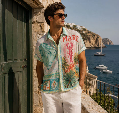 Camisa oversized con ilustraciones marinas y tonos pastel. Un diseño artístico, vintage y fresco ideal para tus veranos en la costa. ¡Cómprala en Badhabitsx!
